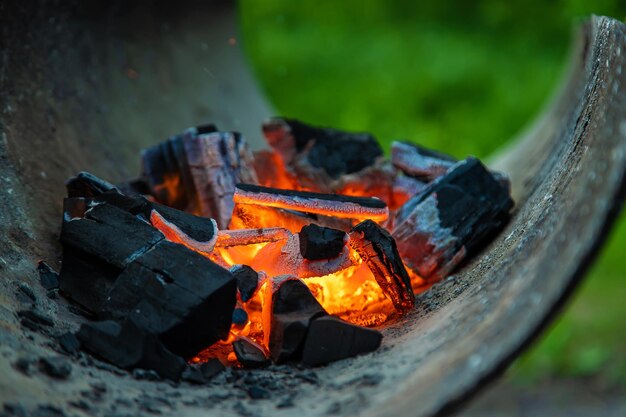 Coals are burning in the grill selective focus