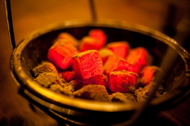 Coals for hookah in the bowl. shisha hookah red hot coals. red Coals for hookah