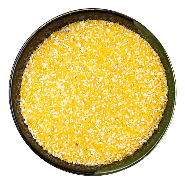 Coarse cornmeal in round bowl isolated