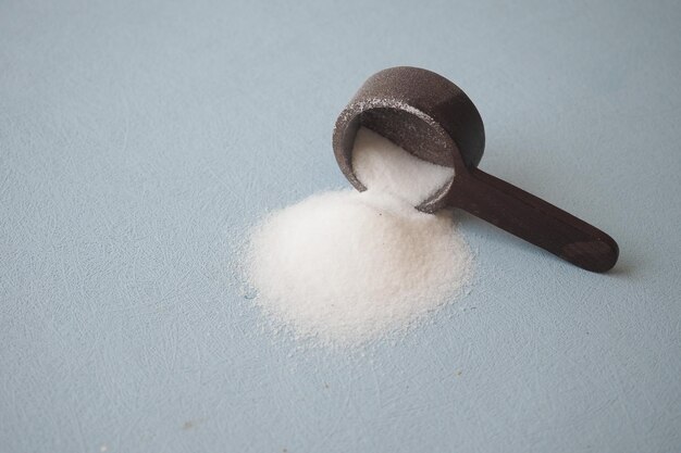 Coarse salt in a wooden spoon