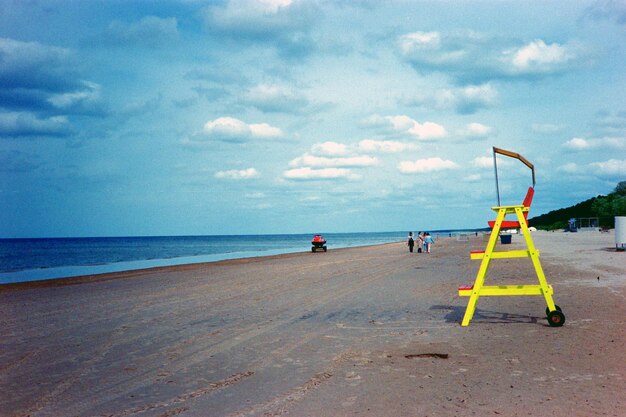 Coast of jurmala in latvia rescue tower on the seashore film photography with noise and grain