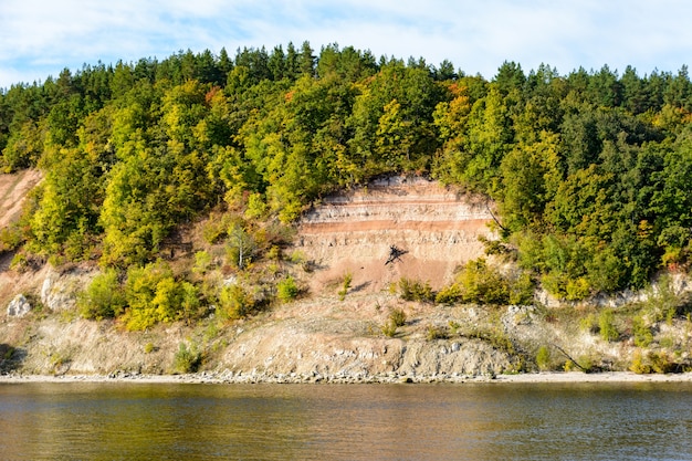 Coast of the Volga River in the middle Volga region in the Republic of Tatarstan. Autumn landscape. Photographing from the ship.