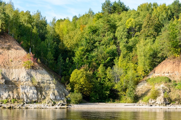 Coast of the Volga River in the middle Volga region in the Republic of Tatarstan. Autumn landscape. Photographing from the ship.