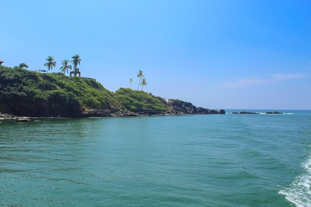 The coastline of Mirissa Sri Lanka after coming back from the whale watching tour Blue sky with copy space for text lighthouse on the cliff