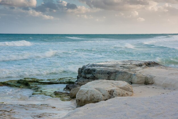 The coastline of white sand and rocks