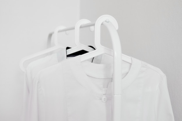 Photo coat hanger with white medical gown