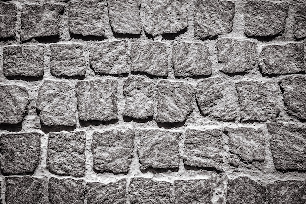 石畳舗装テクスチャ背景 花崗岩の歩道の詳細 石造りの道の平面図 ラフなブロックとビンテージ舗装