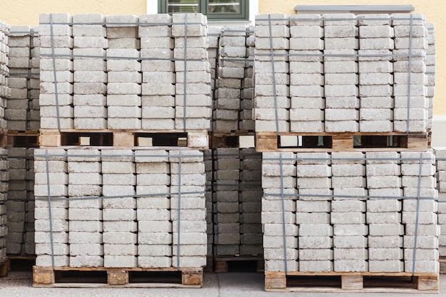 Cobblestones pallets for paving under construction concrete blocks for install new roadway