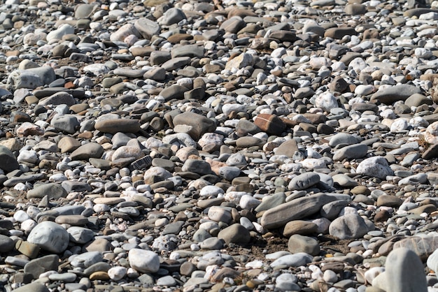 Cobblestones and pebbles on the shore, background