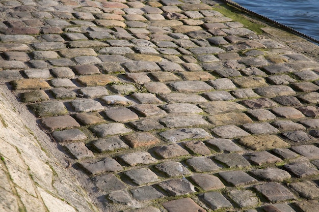 Cobblestones next to River Seine, Paris, France