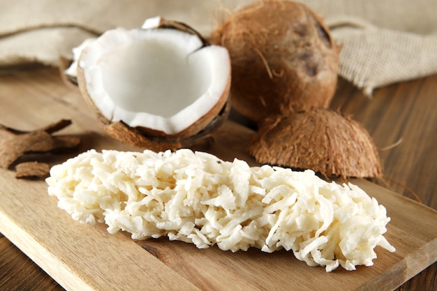 Cocada, coconut candy. Composition on wooden table.