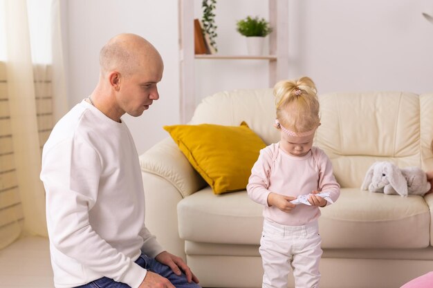 Cochlear implant on the child girl head hearing aid and deafness and innovative health technology co