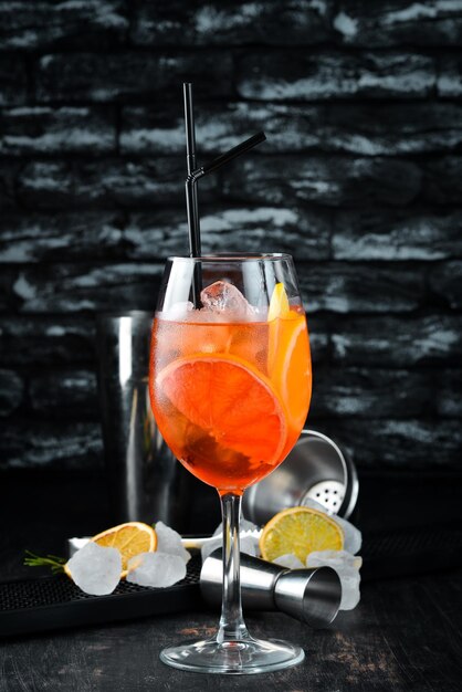 Cocktail Aperol Sprits Alcoholic cocktail On a wooden background Top view Free copy space