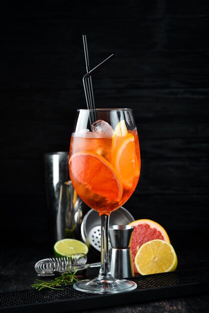 Cocktail Aperol Sprits Alcoholic cocktail On a wooden background Top view Free copy space