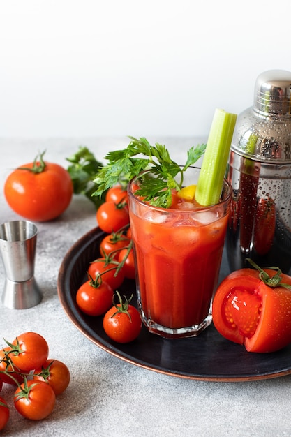 cocktail Bloody Mary with ice, lemon, and celery