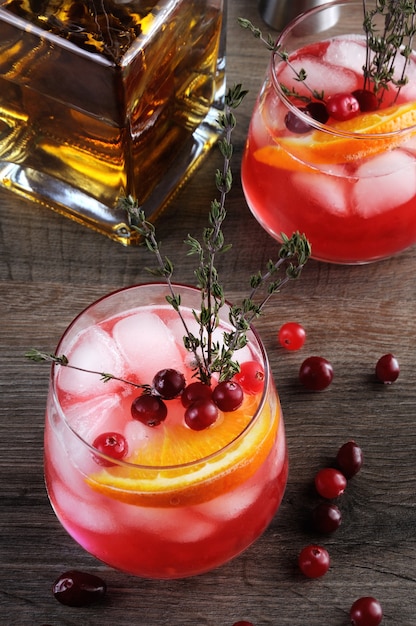 Cocktail Cranberry Orange Bourbon Smash with a spicy hint of thyme