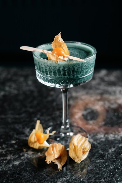 Cocktail decorated with dried flowers side view