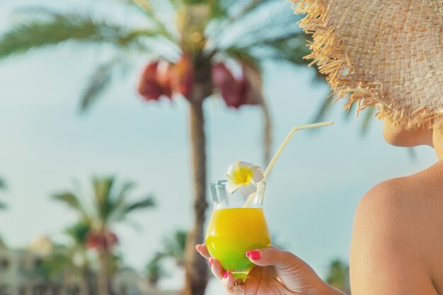 Cocktail in the hands of a woman. 