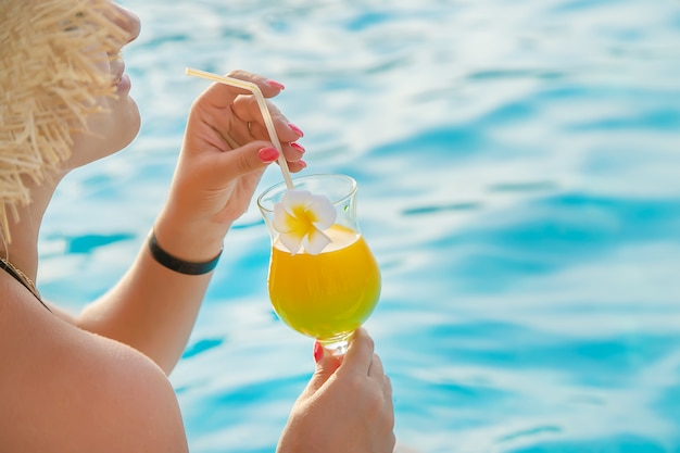 Cocktail in the hands of a woman. 