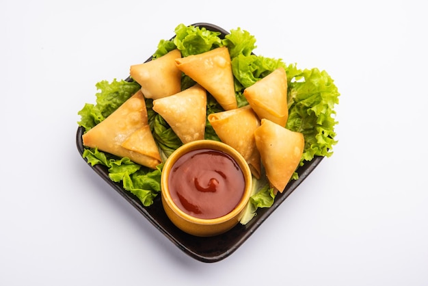 Cocktail mini triangle samosa made using patti or strip, popular home made snack from India