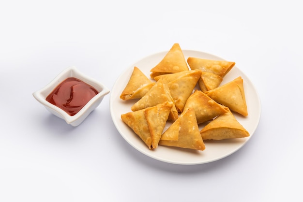 Cocktail mini triangle samosa made using patti or strip, popular home made snack from India