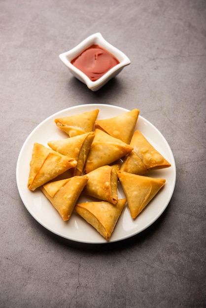 Cocktail mini triangle samosa made using patti or strip, popular home made snack from India