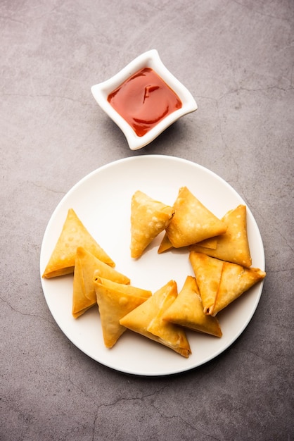Cocktail mini triangle samosa made using patti or strip, popular home made snack from India