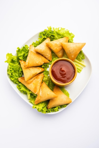 Cocktail mini triangle samosa made using patti or strip, popular home made snack from India