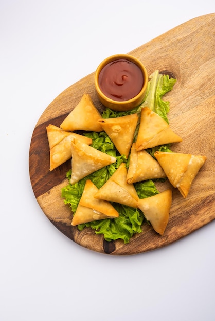 Cocktail mini triangle samosa made using patti or strip, popular home made snack from India