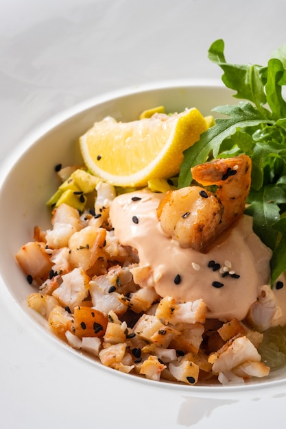 Cocktail salad with avocado, tiger shrimps and grapefruit.