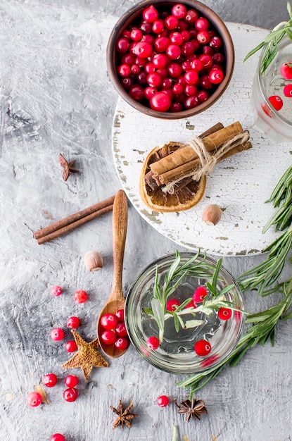 Cocktail with cranberry, rosemary and ice