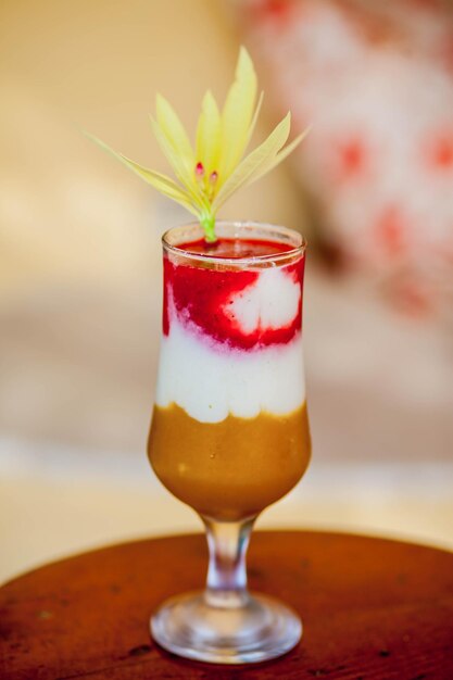 A cocktail with a flower on top