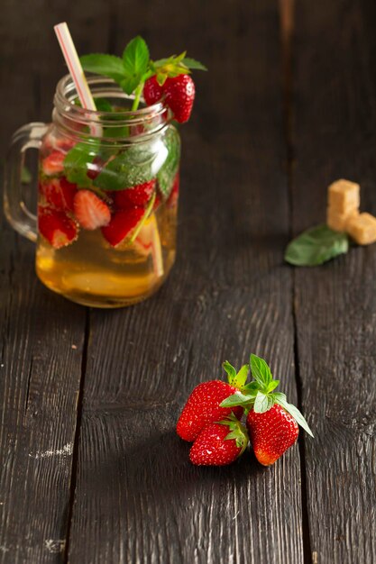 cocktail with fresh fruits berries and mint