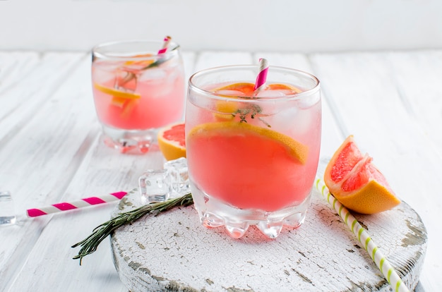 Cocktail with grapefruit slice on a wooden table 