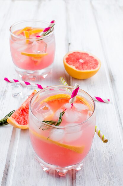 Cocktail with grapefruit slice on a wooden table 