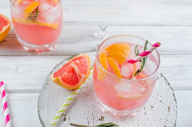 Cocktail with grapefruit slice on a wooden table 