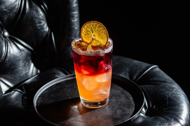 Cocktail with ice on a dark background Bar