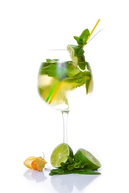 Cocktail with mint, lime and tonic. On a white background. Top view.