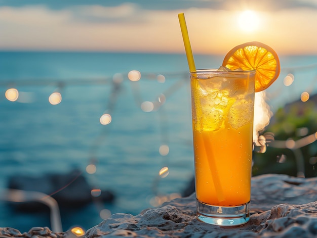 Cocktail with orange on the beach at sunrise Selective focus