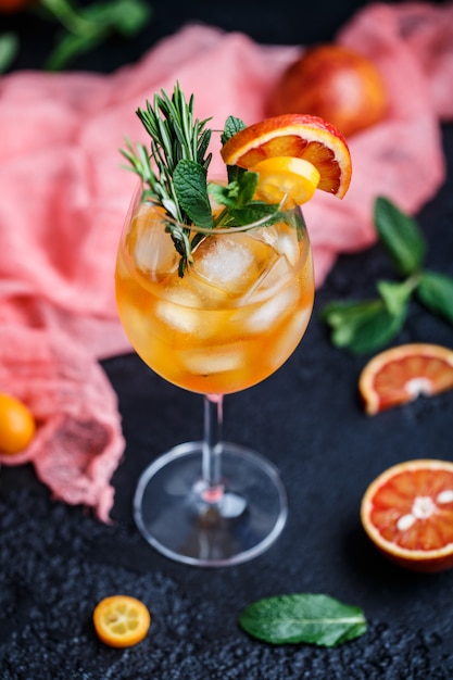 Cocktail with orange juice and ice cubes. Glass of orange soda drink