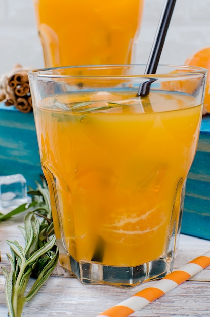 Cocktail with tangerines, juice and ice