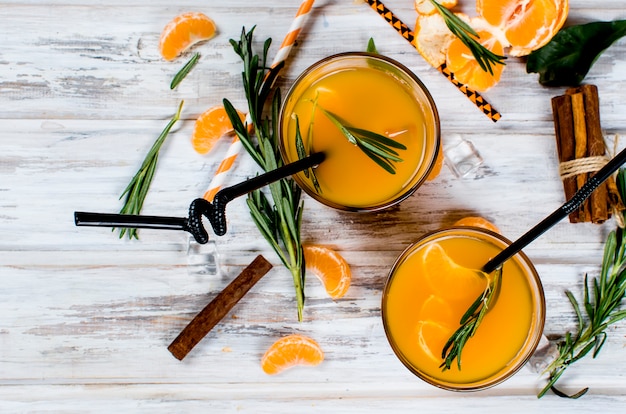 Cocktail with tangerines, juice and ice