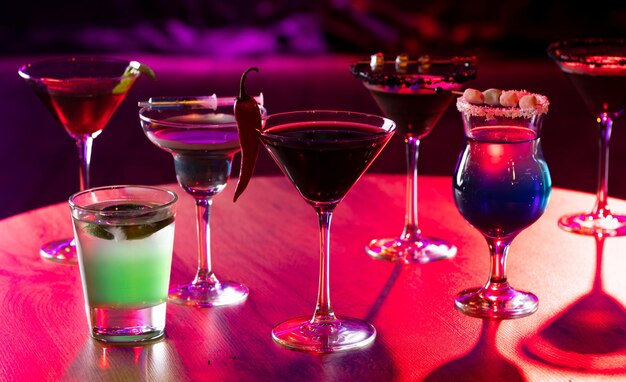 cocktails in glasses on a wooden table