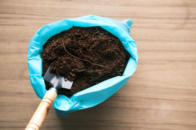 Coco peat and gardening tools a table with copy space