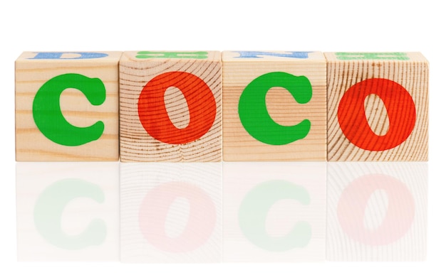 Coco word formed by colorful wooden alphabet blocks isolated on white background