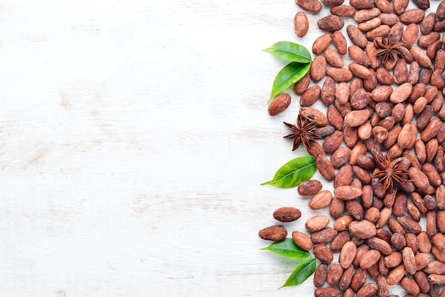 Cocoa beans on a white background Top view Free copy space