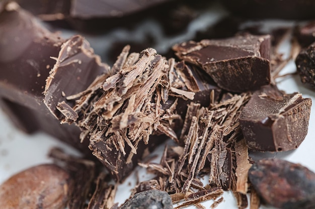 Cocoa beans with chocolate on a white background Shalllow dof