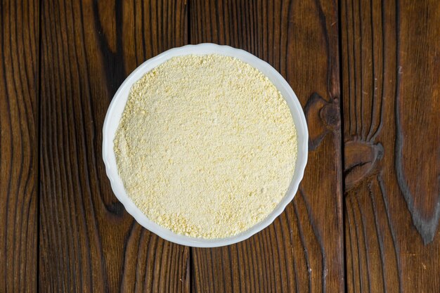 cocoa butter in a bowl on a wooden table