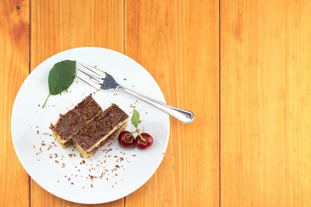 Cocoa cherry cake, called 'Danube Wave'. Top with vanilla cream and chocolate.  