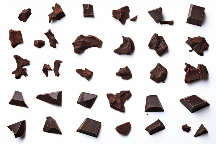 Cocoa Delights A Stunning Collection of Dark Chocolate Chunks Flying Pieces and Shavings on a Whi